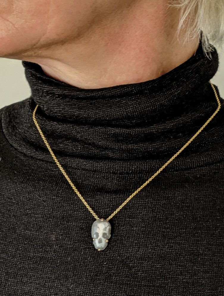 Skull pendant with gold