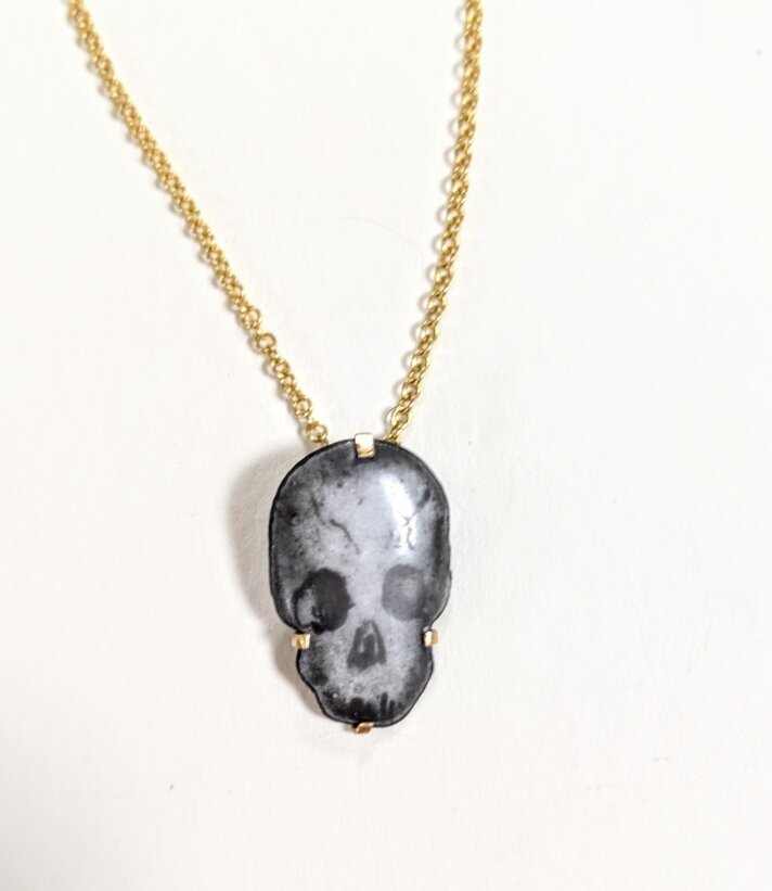 Skull pendant with gold