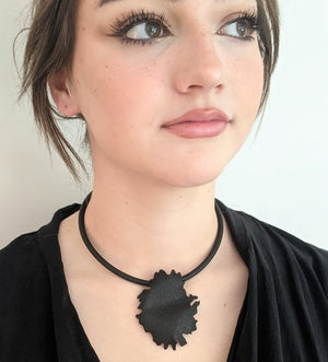 
                
                    Load image into Gallery viewer, Black peony silhouette necklace on model
                
            