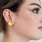 gold enameled bowl earrings on model
